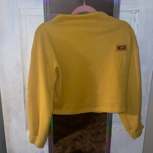 Yellow sweater slight crop but no stomach showing when worn w/ jeans or leggings